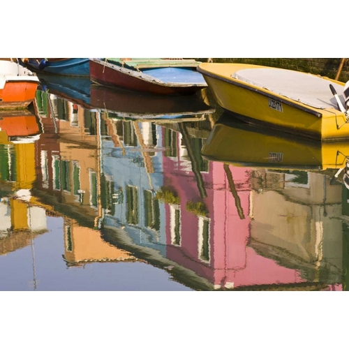 Italy, Burano Boats on a canal with reflections